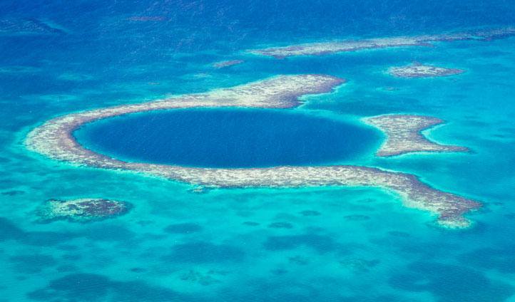 A5: So unfair (so many). But #BlueHole, #Belize from above followed by a scuba beneath the veneer. #LPChat #lptop500 http://t.co/eRL2ix0DEg