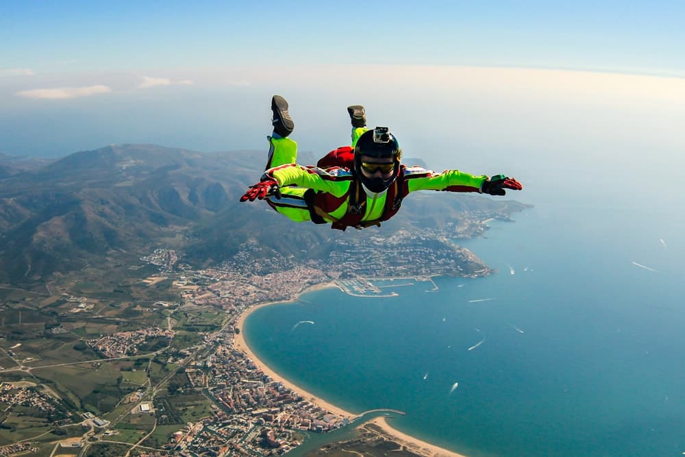 A skydiver above an island