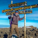 Peter on the summit of Mount Kilimanjaro in Tanzania