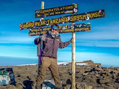 Peter on the summit of Mount Kilimanjaro in Tanzania