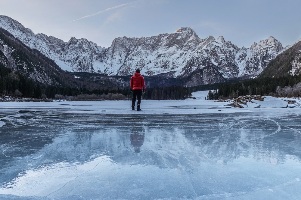 man on frozen lake essentials for safe travel