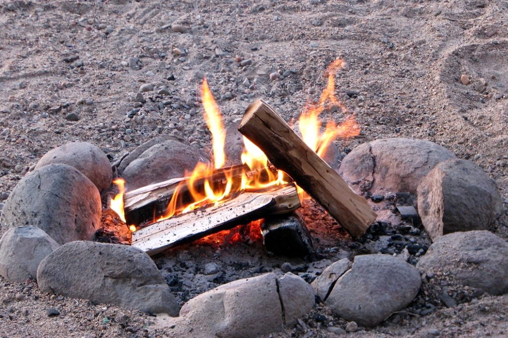 Using dry wood to build a campfire