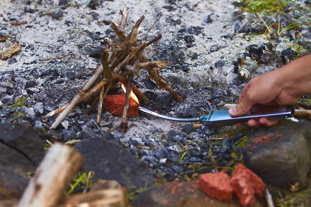 How to build a campfire with a wind-resistant lighter 