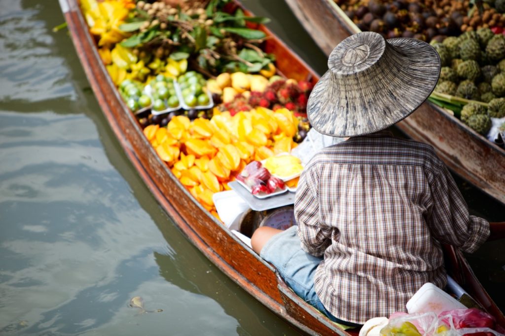 travel skills: bartering with woman in boat