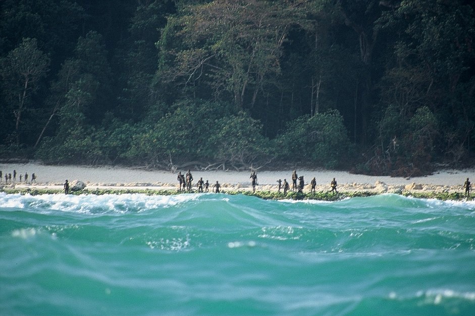 Sentinelis lined up on the shore of North Sentinel Island, ready to fight off visitors