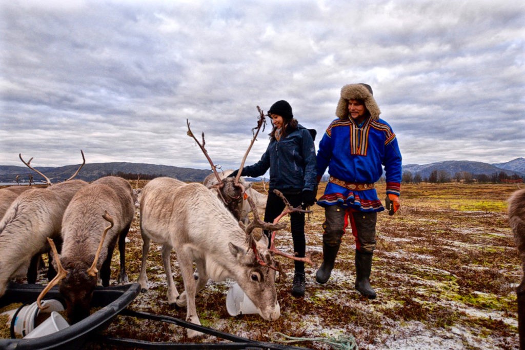 Kia and Johan-Issak feeding Arctic reindeer in Tromso