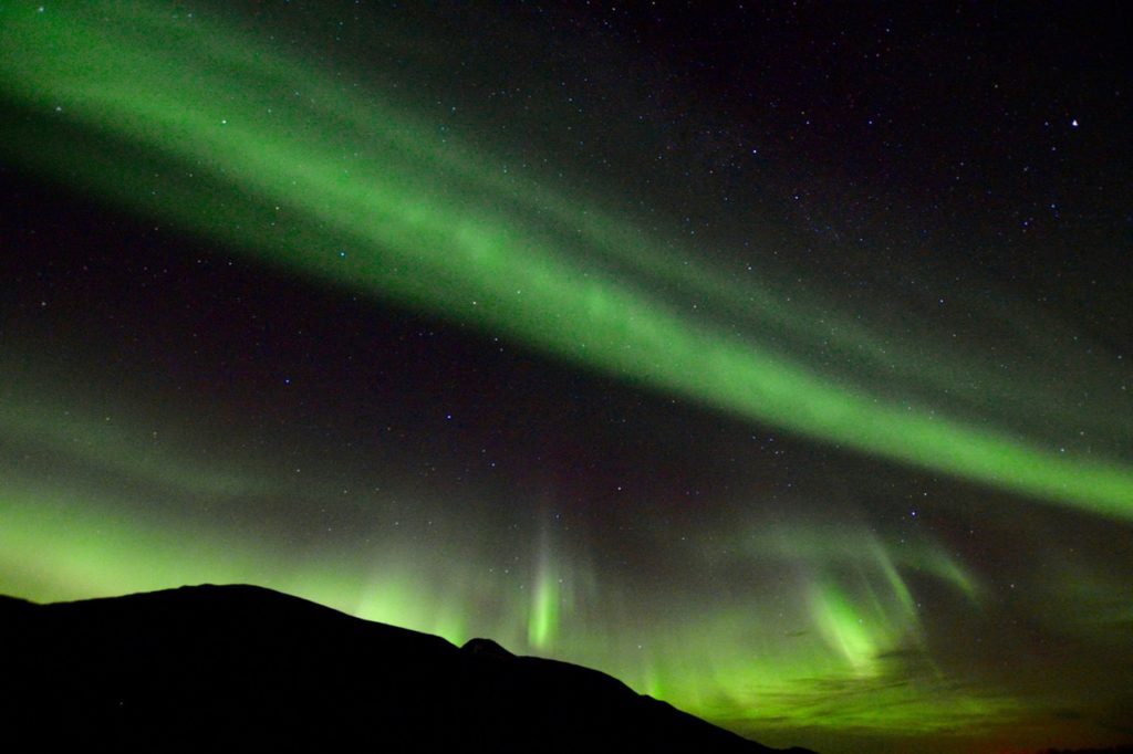 a photo taken while chasing the northern lights in tromso