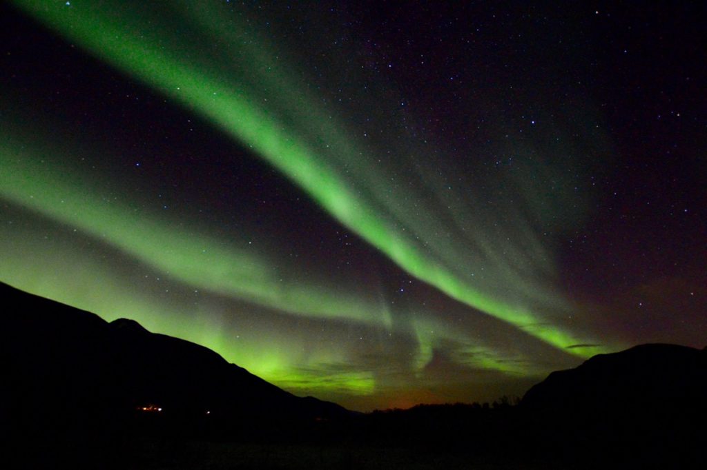 a photo taken while chasing the northern lights in tromso