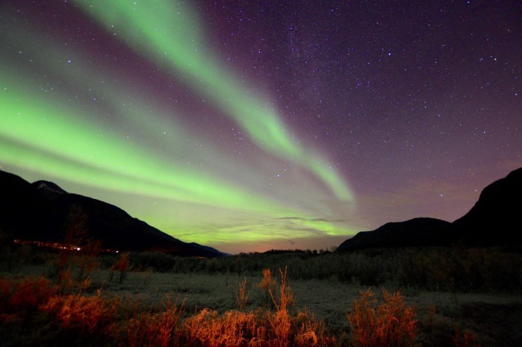 a photo taken while chasing the northern lights in tromso