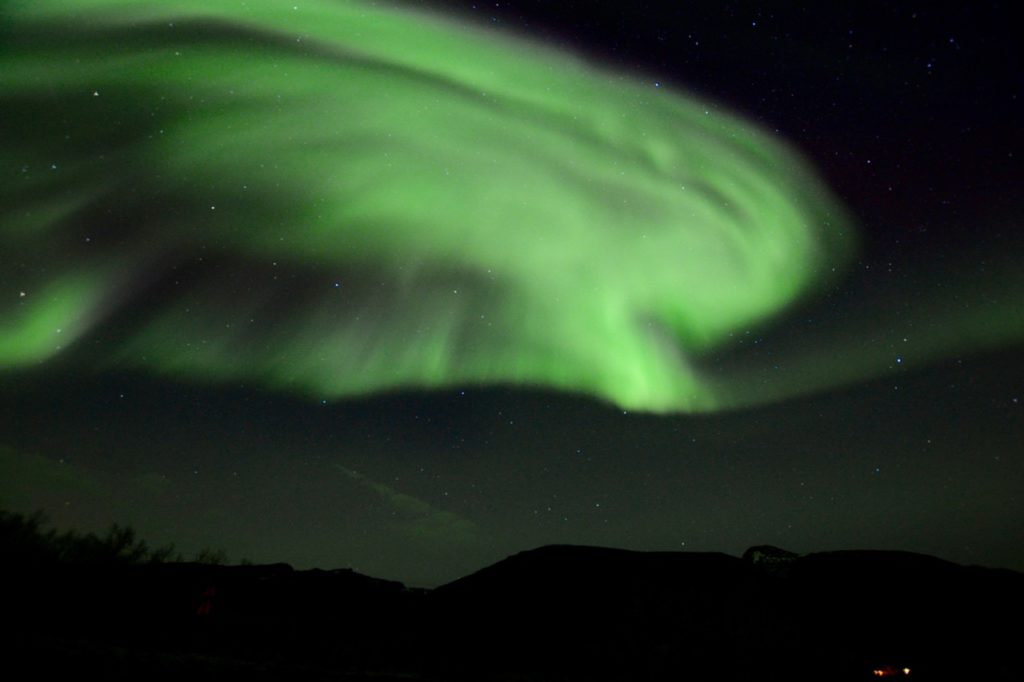 a photo taken while chasing the northern lights in tromso