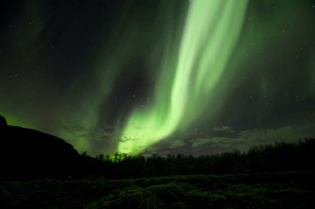 a photo taken while chasing the northern lights in tromso