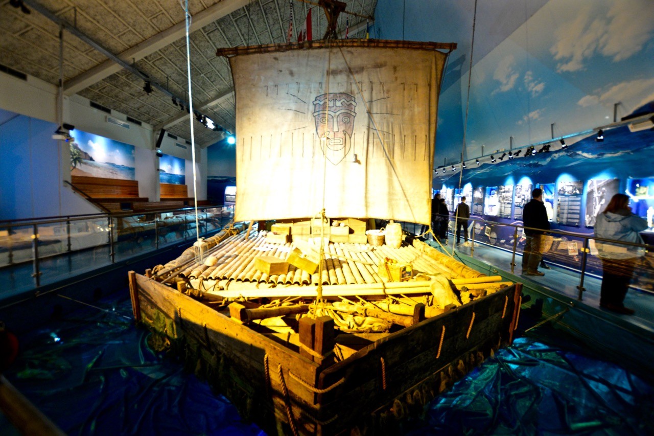 Kon Tiki raft set amid muted light at the Museum