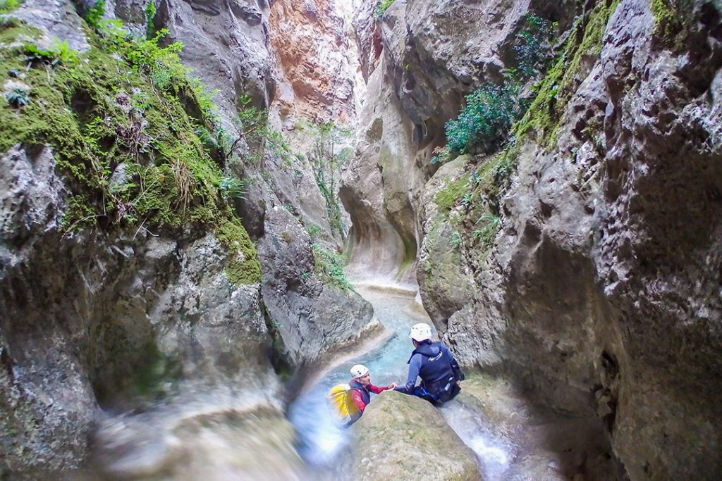 Jumping from a ledge in Hell's Canyon in Catalonia