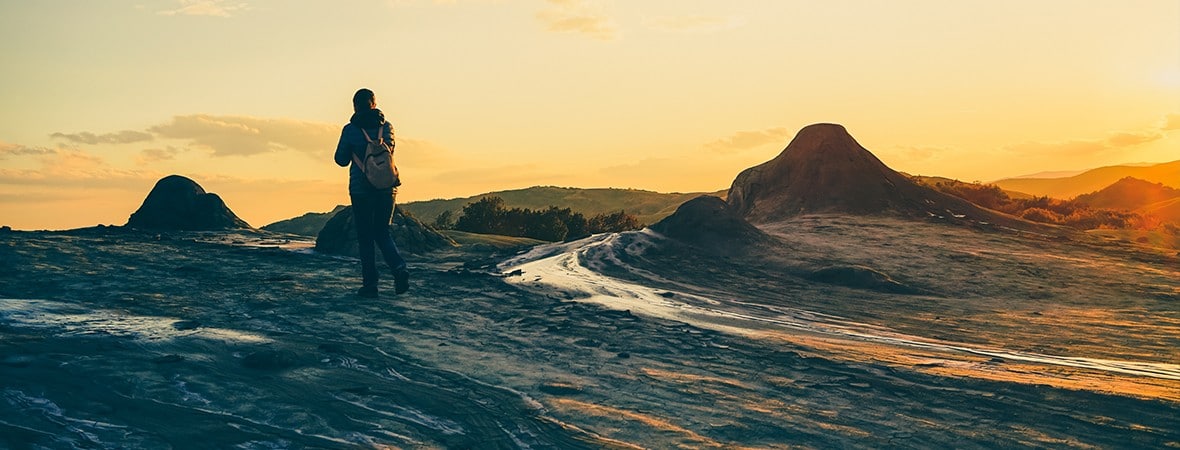 solo hiking tips: woman on a volcano