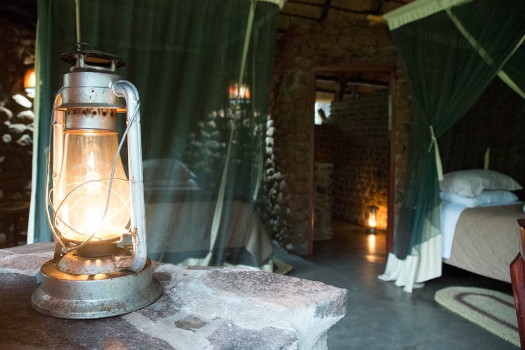 visiting eswatini: our bed with a mosquito net