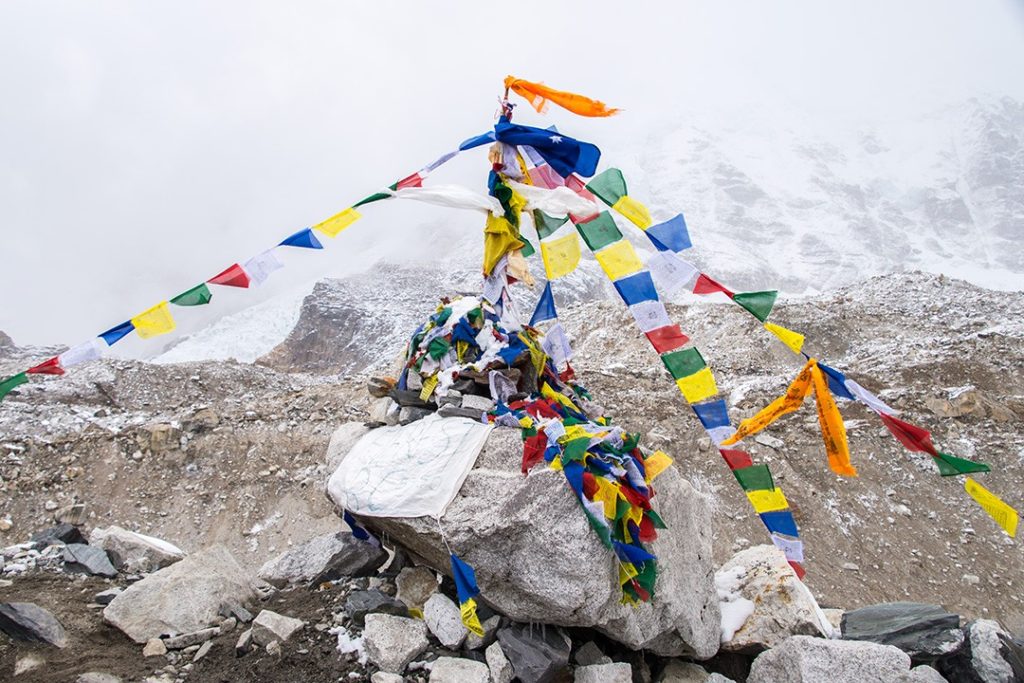 The cairn bedecked with prayer flags at EBC at the end of the Everest base camp trek