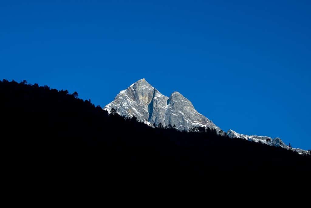 Khumbila with a clear sky and forest