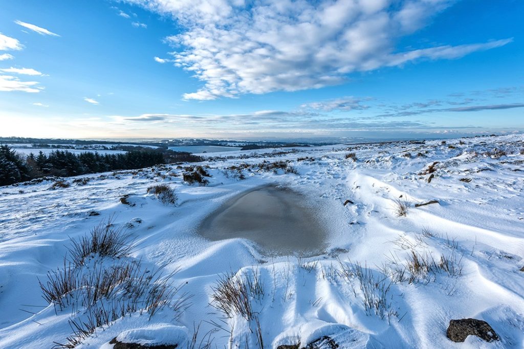 A frozen pond on Anglezarke Moor in Lancashire is one of the best outdoor destinations in Britain