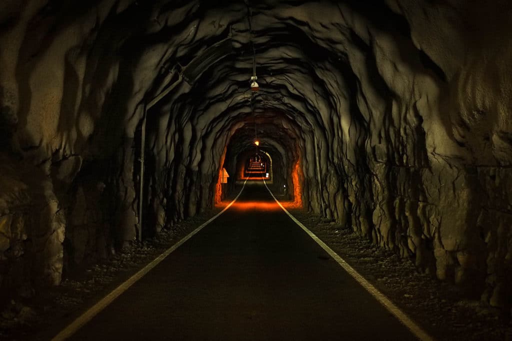A single lane tunnel while driving in the Faroe Islands