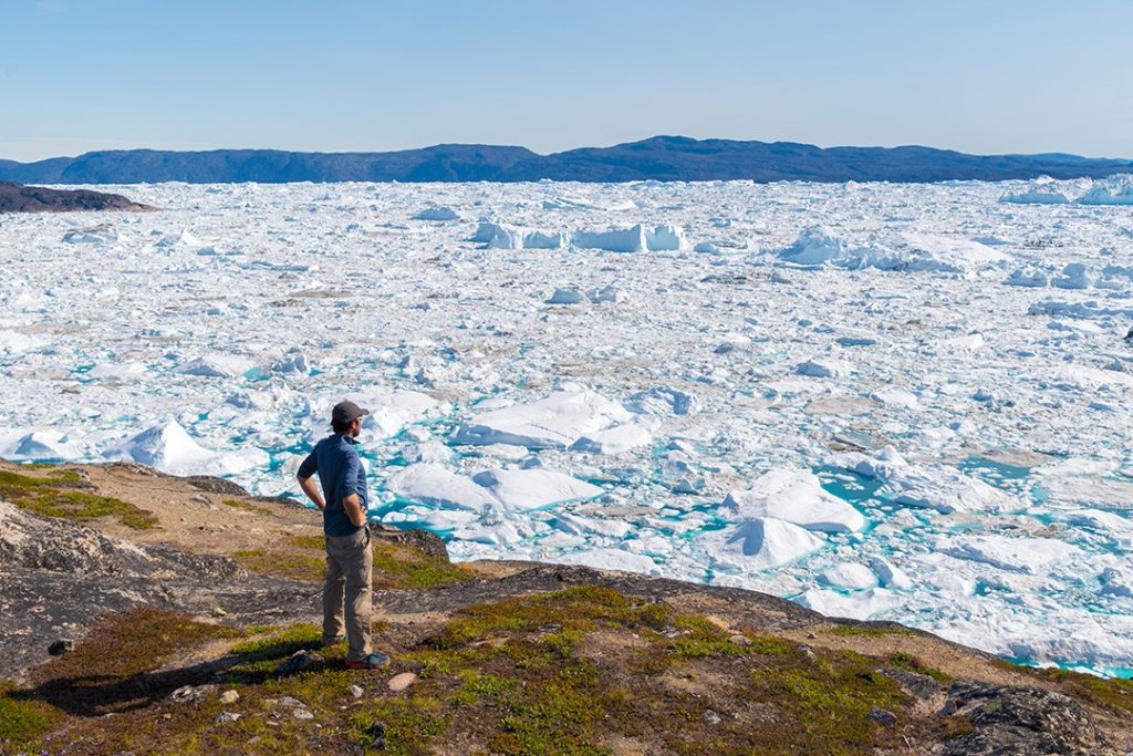 Hiking around Ilulissat looking across the bay