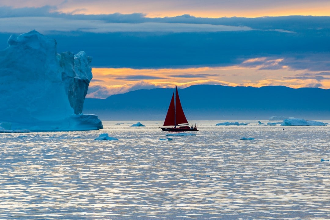 midnight sun iceberg sightseeing ilulissat sailboat