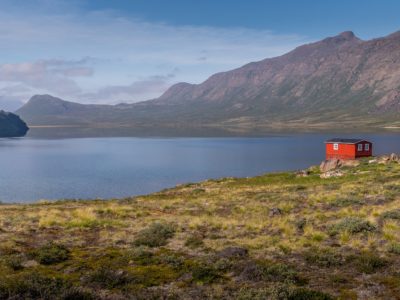 trekking the arctic circle trail lead image with hut and lake