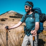 Peter in a base layer while hiking in warm weather