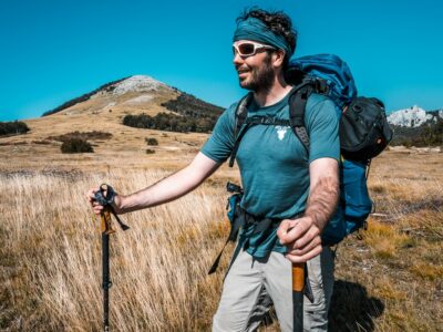 Peter in a base layer while hiking in warm weather