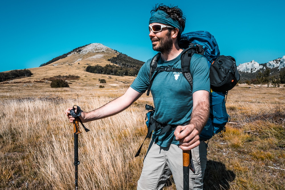 Peter in a base layer while hiking in warm weather