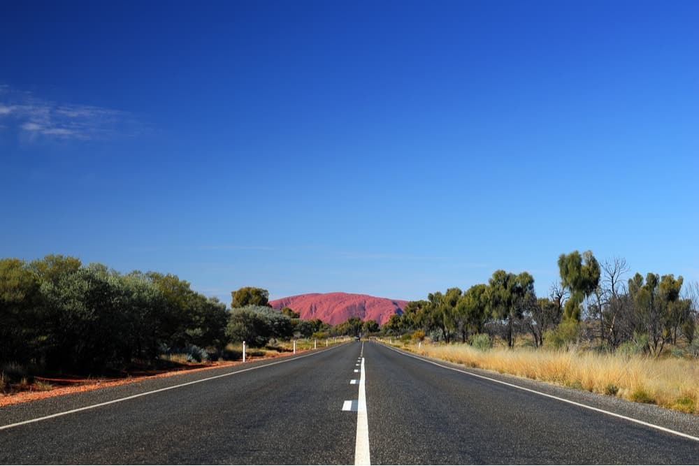 A road heading towards Uluru