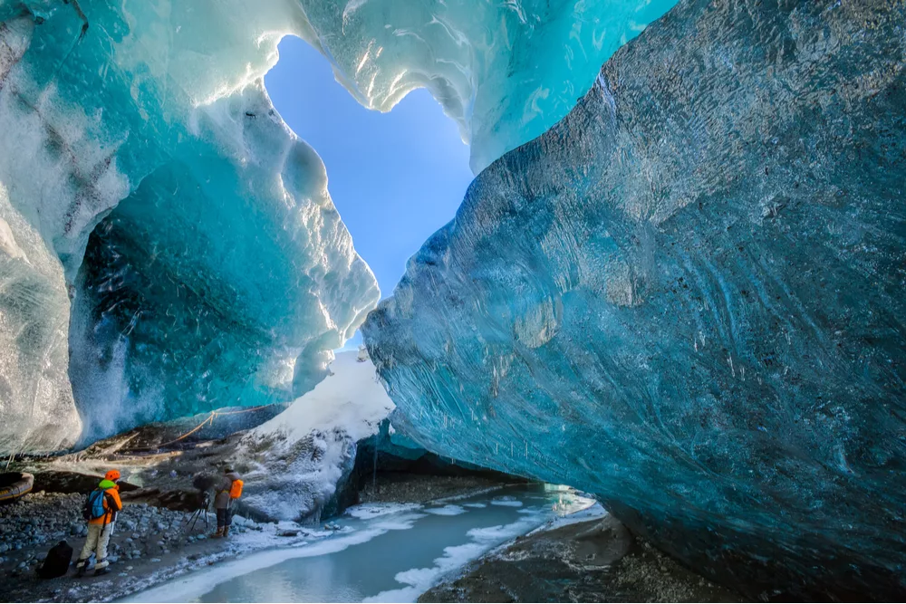 Tourists inside an ice cave in Iceland