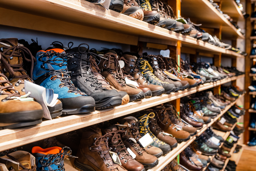 Shelves of hiking boots in an outdoor store