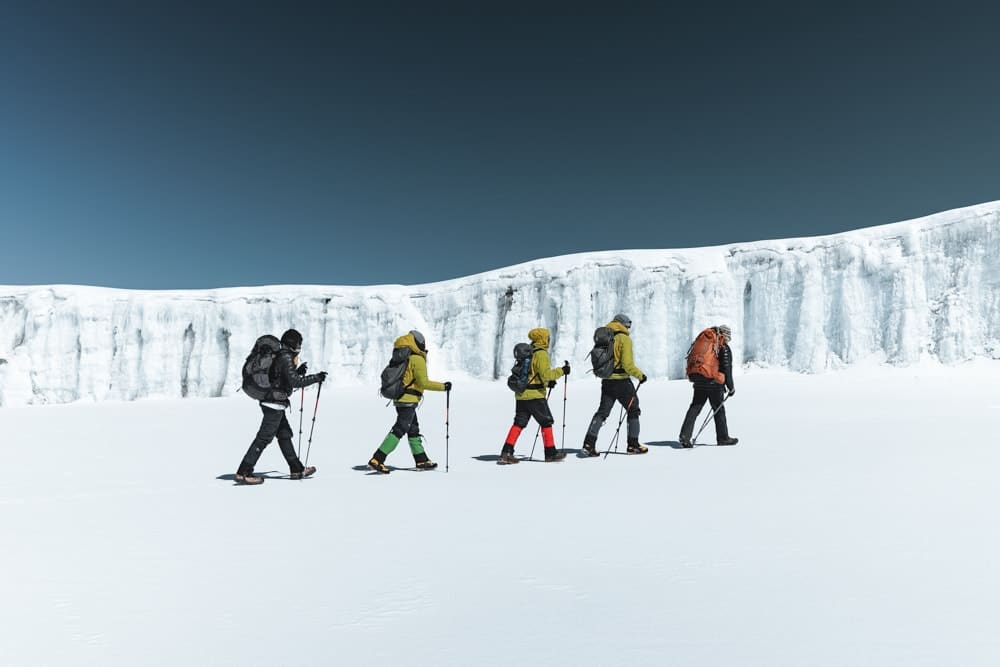 Trekkers crossing the snow on Kilimanjaro