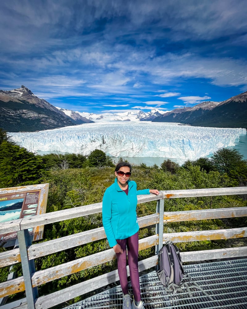 Kia posing in front of walkway at Perito Moreno Glacier 