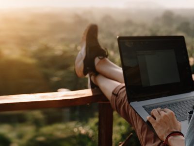 woman using laptop in one of the countries offering remote work visas