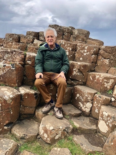 David Sklar sitting on the rocks at Giant's Causeway