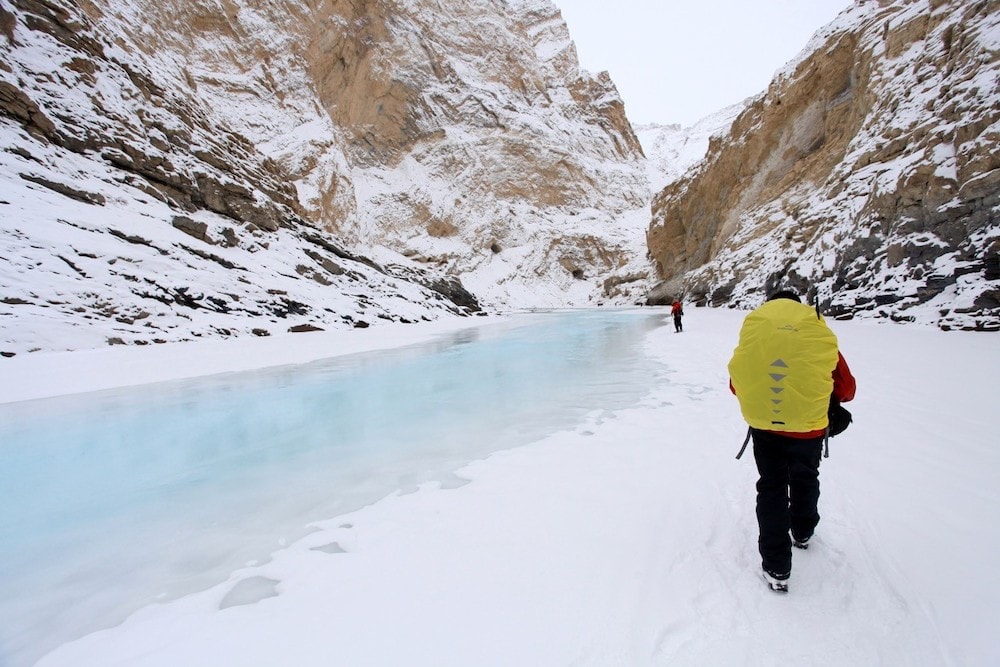 A hiker alongside the icy River Zanskar– one of the world's most dangerous hikes