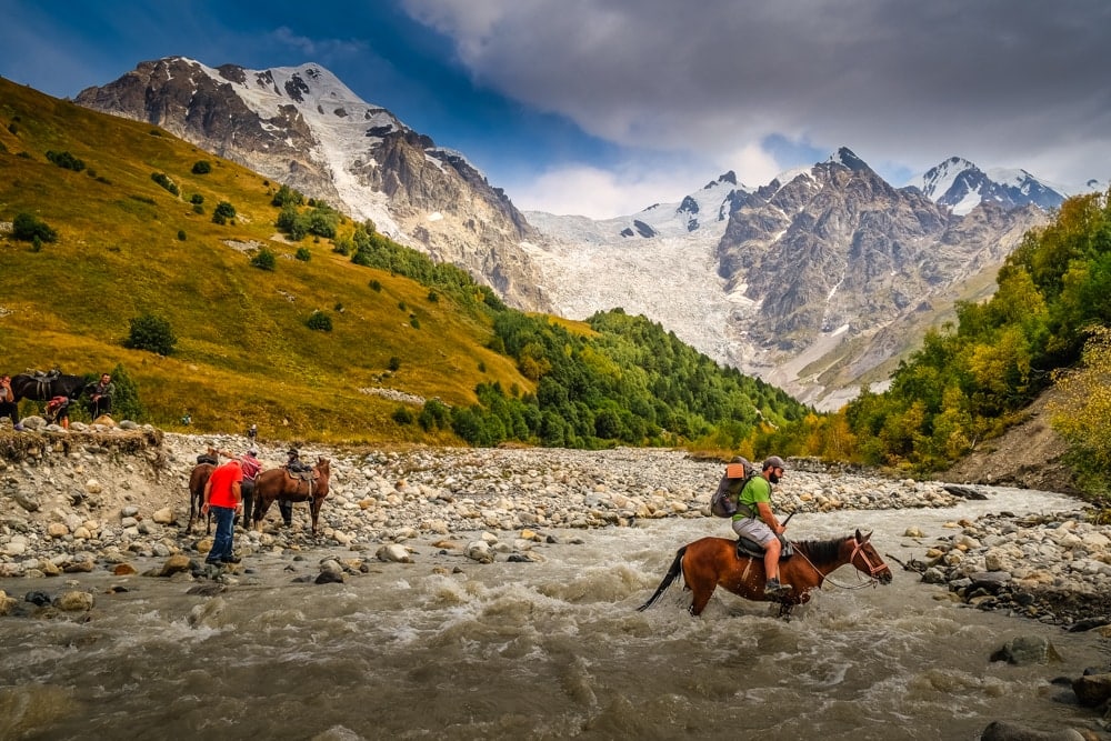 Crossing the Adishi River on horseback