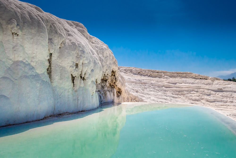 Blue skies and turquoise waters seen while visiting Pamukkale