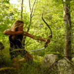 Miriam Lancewood using a bow an arrow