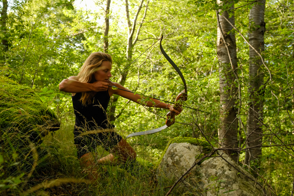 Miriam Lancewood using a bow an arrow