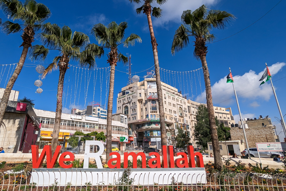 A red and white 'We Love Ramallah' sign