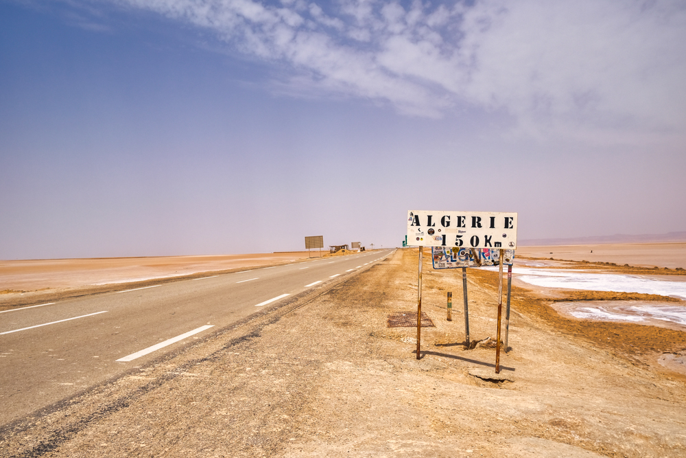 A road sign to Algeria in the Chott el Djerid