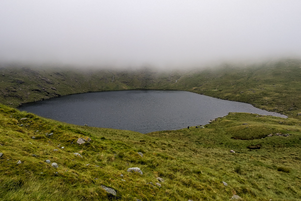 A lake surrounded by mist