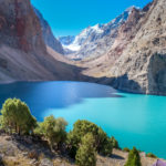 A bright emerald lake in the Fann Mountains of Tajikistan