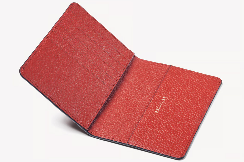 A red passport cover as a Christmas gift for a traveller