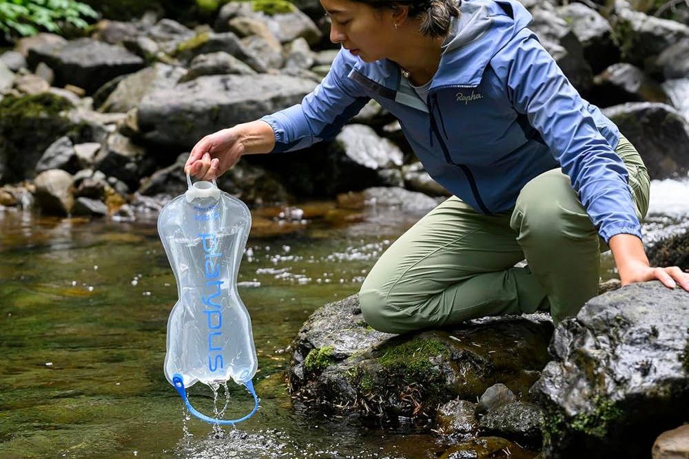 A woman refills her water filter