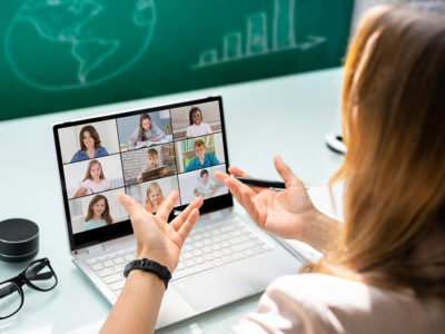 Teacher Online Meeting With students on laptop