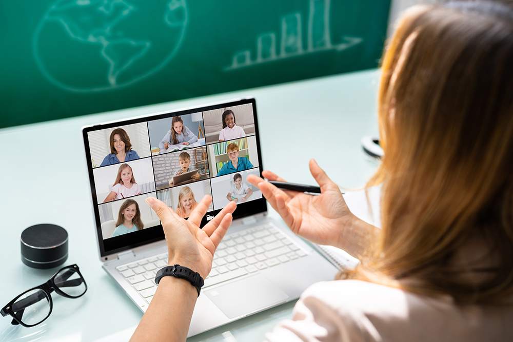 Teacher Online Meeting With students on laptop