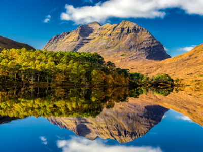 Liathach and reflection of it in Loch Clair on a sunny autumn day